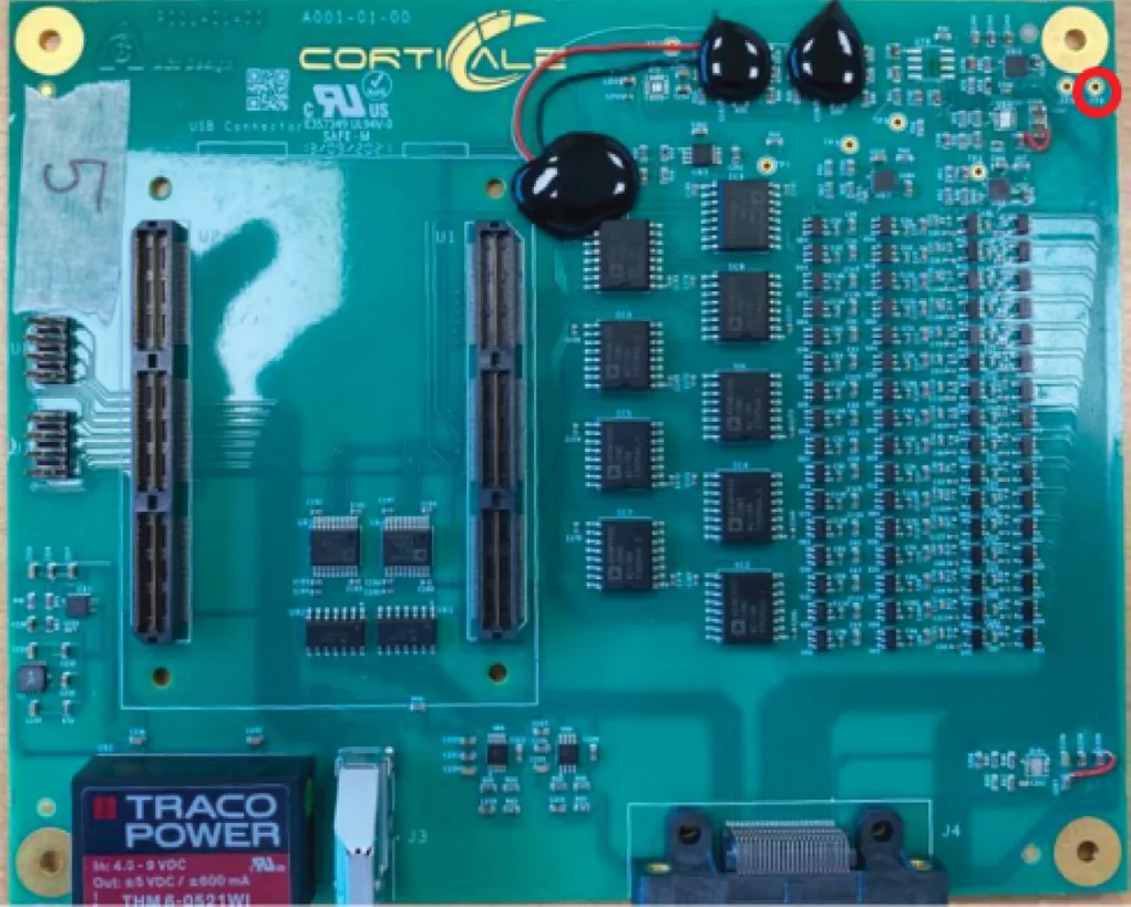 An alligator lead from the stereotaxic frame to the TP8 analog ground pin on the interface box PCB